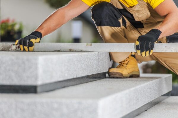 Home builder measuring a stair
