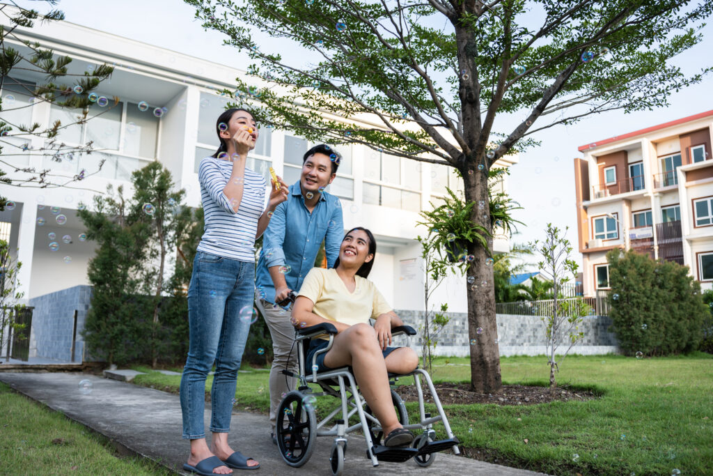 Group of Asian young man and woman friends walking together in garden.