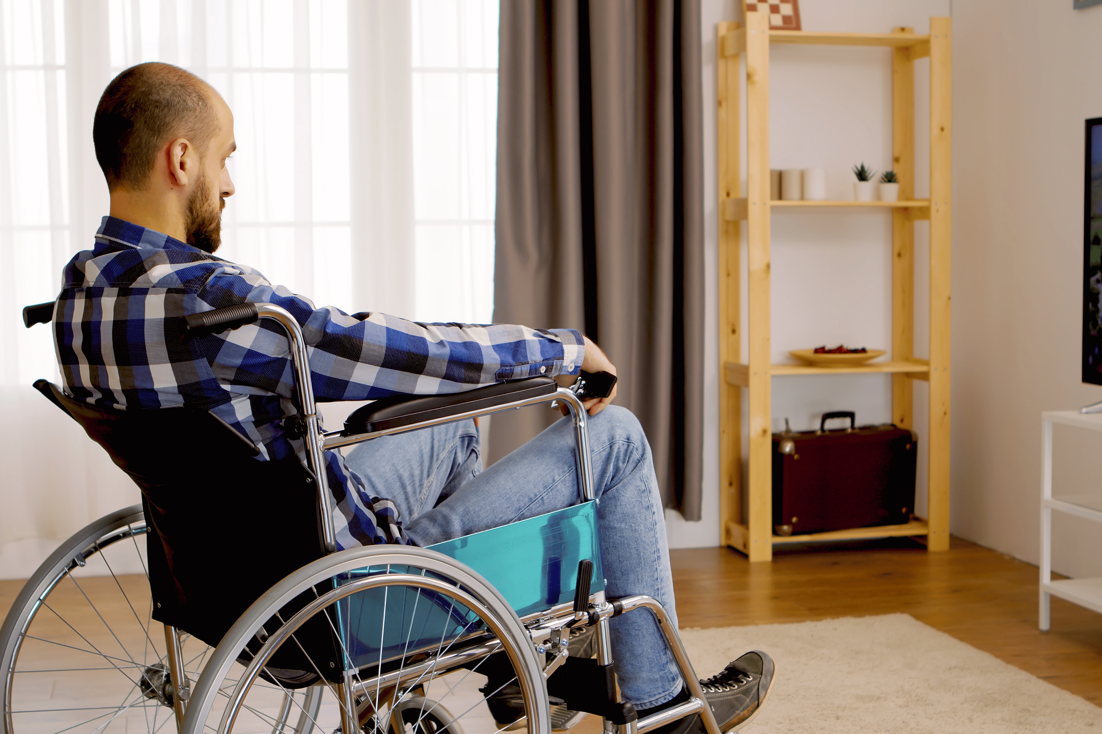 thoughtful man watching tv